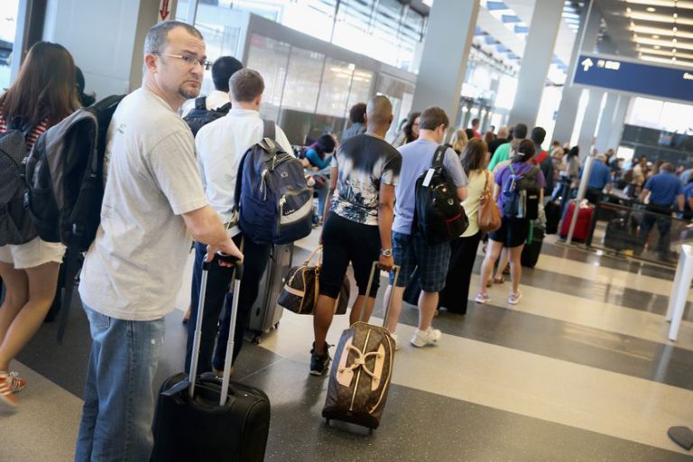 Passengerswaittocheckbagsinohare.jpg.838x0 q80